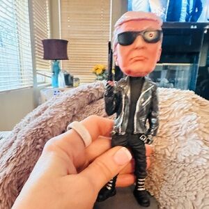 Black and Silver Bobblehead Figure